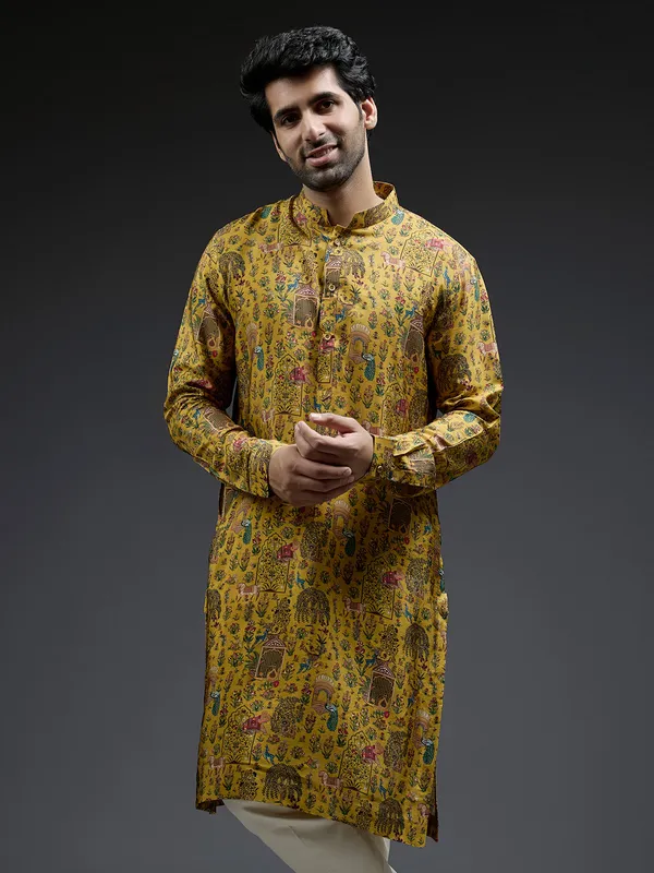 Rich mahendi yellow silk kurta suit in applique print