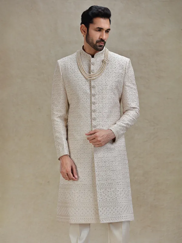Rose gold coloured textured long sherwani in silk
