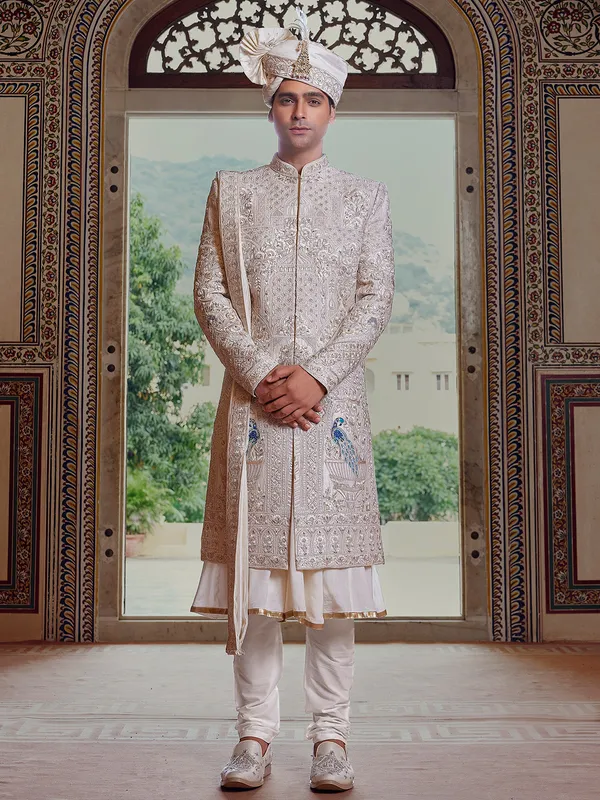 Royal cream peshwai style sherwani with resahm work