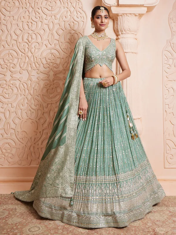 Sage green chinnon lehenga choli with heavy work