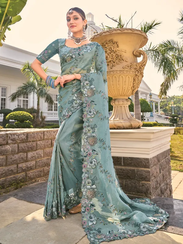 Sea green organza saree for festive elegance