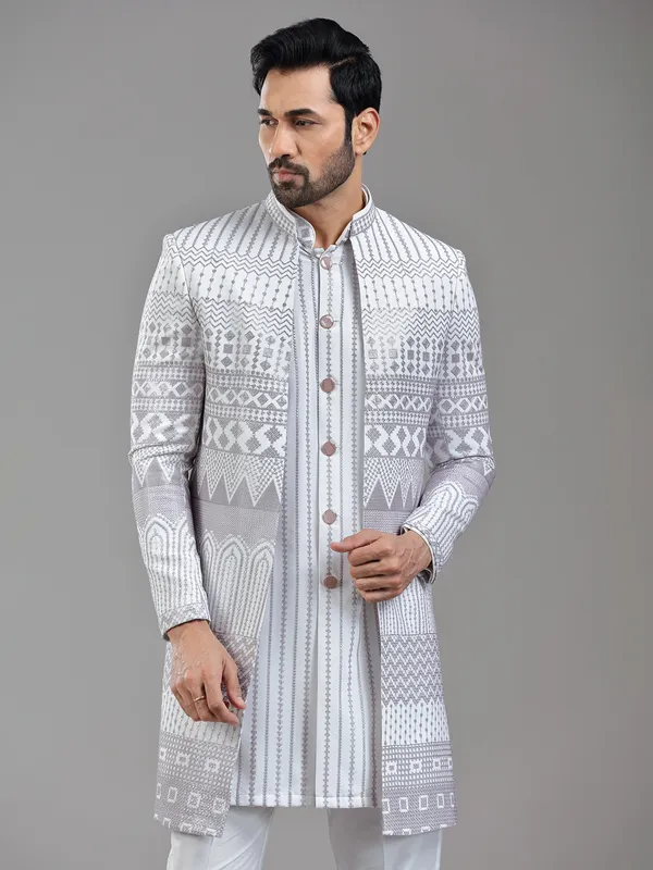Sophisticated white silk jacket style indowestern with resham
