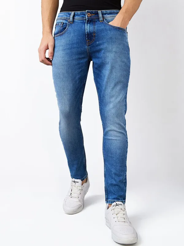 SPYKAR washed mid blue slim fit denim for men
