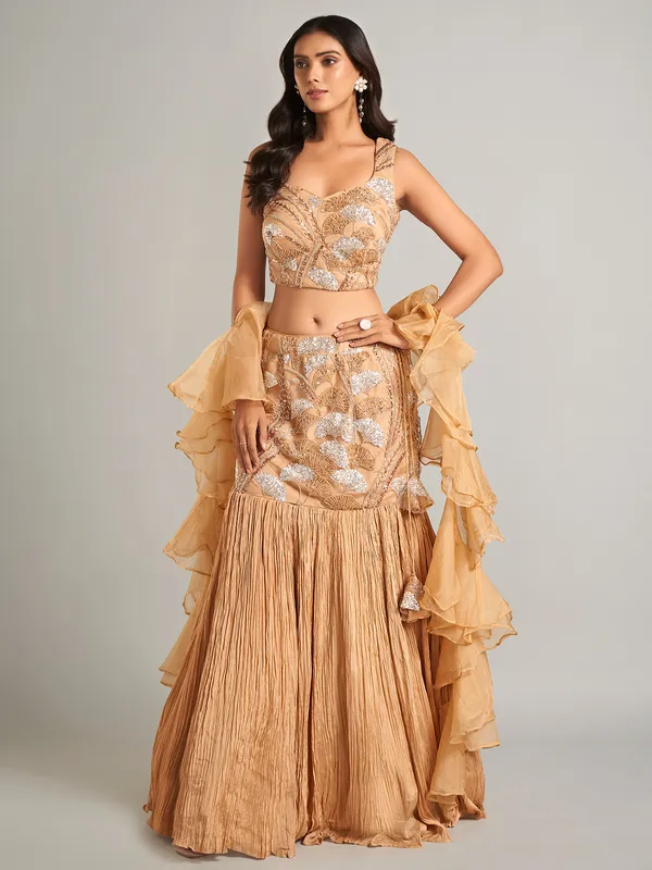 Stunning beige lehenga choli with ruffle dupatta