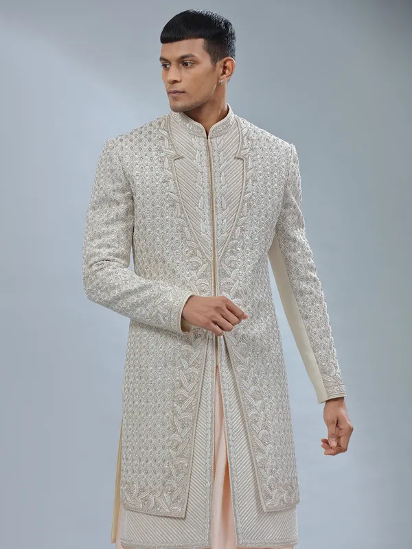 Stunning Off white and peach silk peshwai sherwani