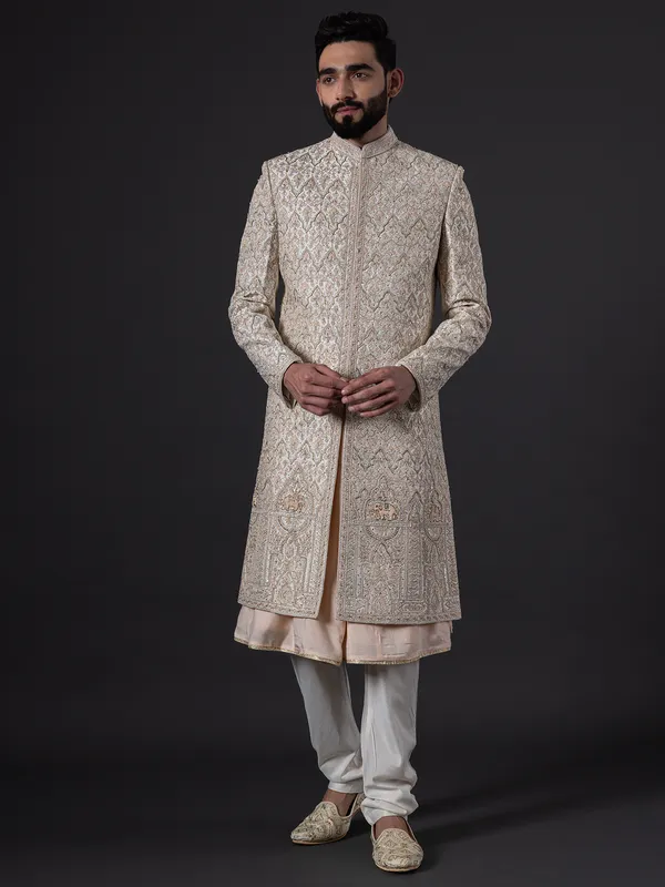 Stunning peach silk wedding sherwani for groom