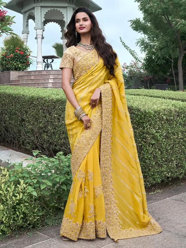 Stunning yellow saree in tissue silk