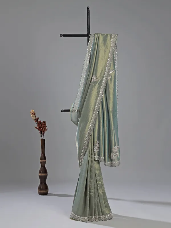 Teal blue tissue silk saree for festive glam