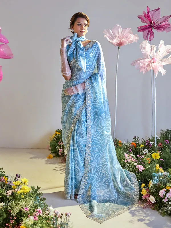 Trendy blue printed satin saree