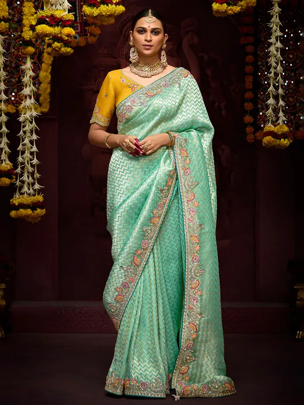Trendy light green zari weaving saree