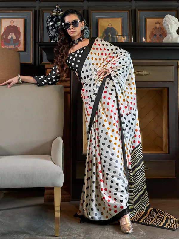 Trendy off-white crepe patola printed saree
