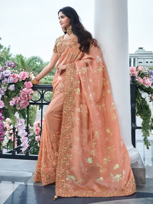 Trendy peach tissue silk saree for festive