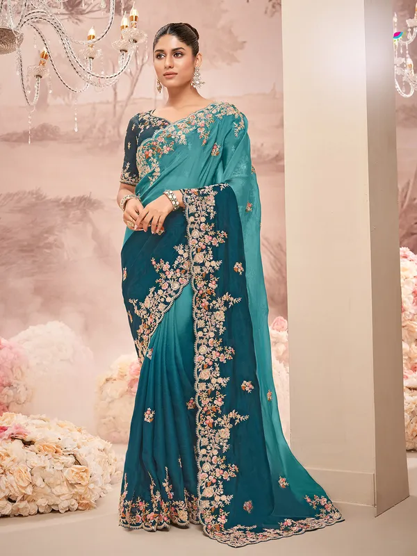 Trendy teal blue georgette saree