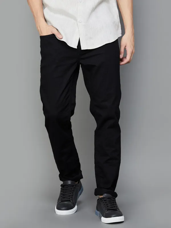 UCB solid black denim jeans with skinny fit