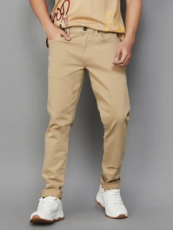 UCB solid khaki slim tapered fit denim jeans