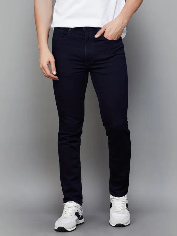 UCB solid navy slim tapered fit denim jeans for men