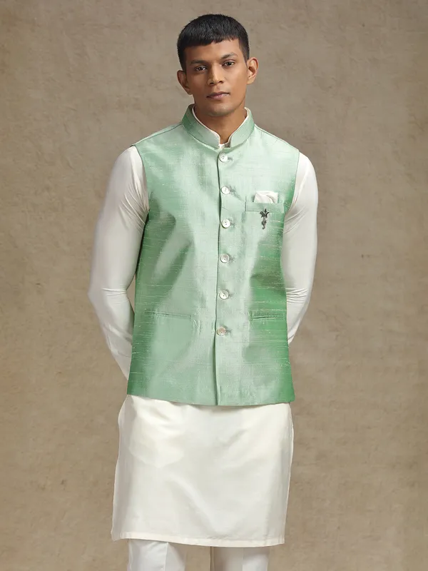 White and light green waistcoat set with intricate embroidery