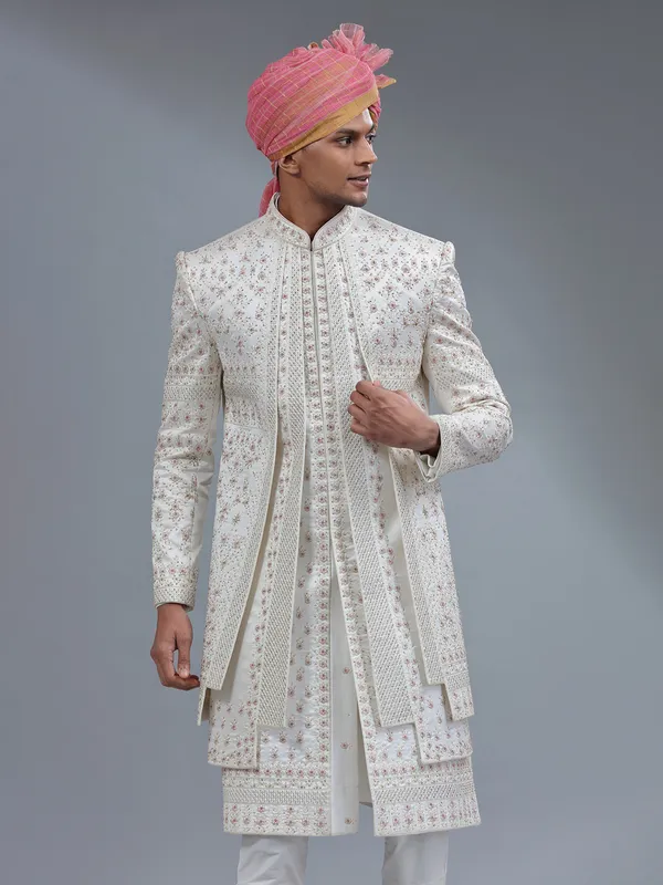 White jacket style sherwani with matching bottom