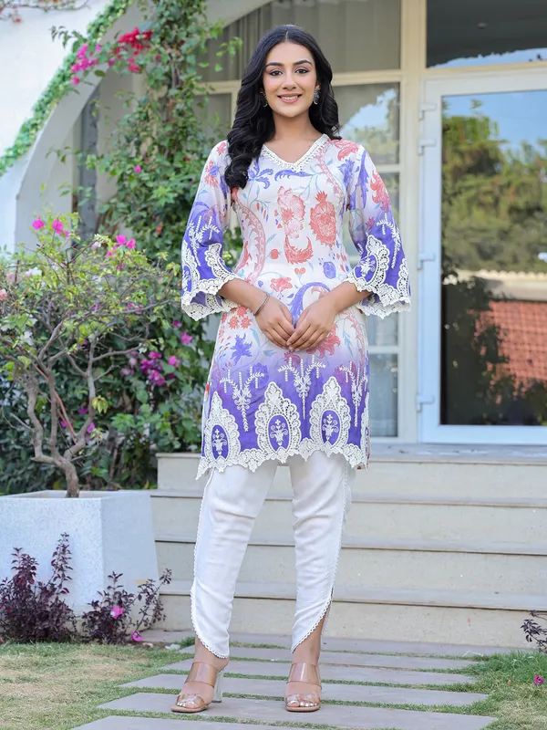 White silk suit with embroidered festive charm