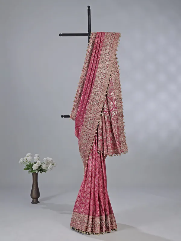 Wine kanjivaram silk saree with cutdana brilliance