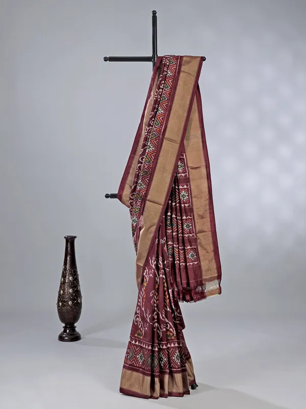 Wine zari weaving patola silk saree with regal prints