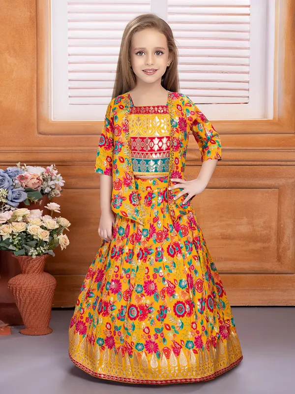 Yellow jacket style lehenga choli in silk