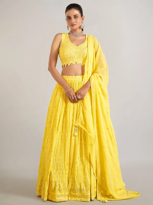 Yellow wedding wear lehenga choli in soft georgette
