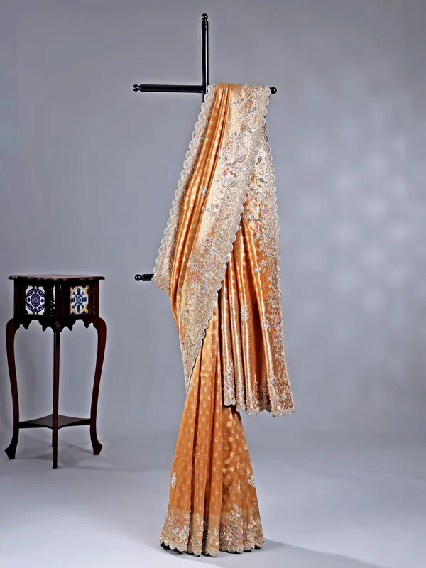 Pastel orange shimmer saree with festive glow