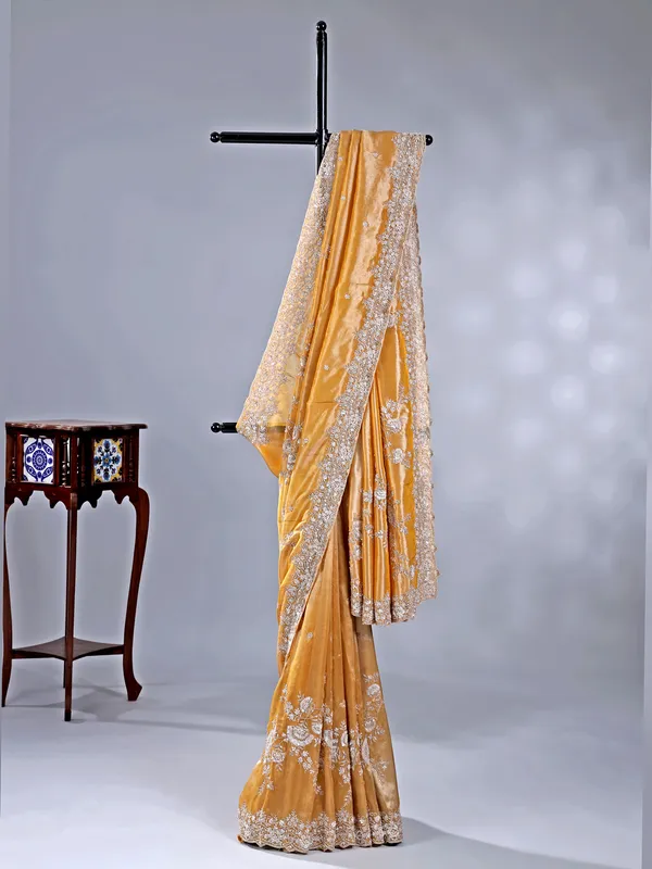 Gold silk saree with haldi perfect finish