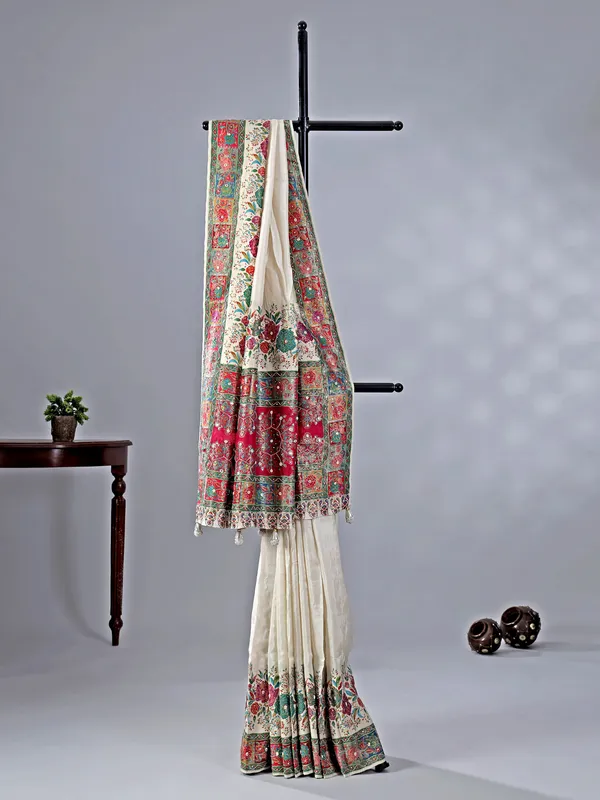Off white silk saree with beaded detailing